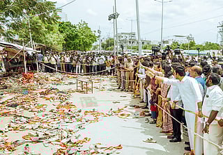 People gather at the place where the stampede occurred.