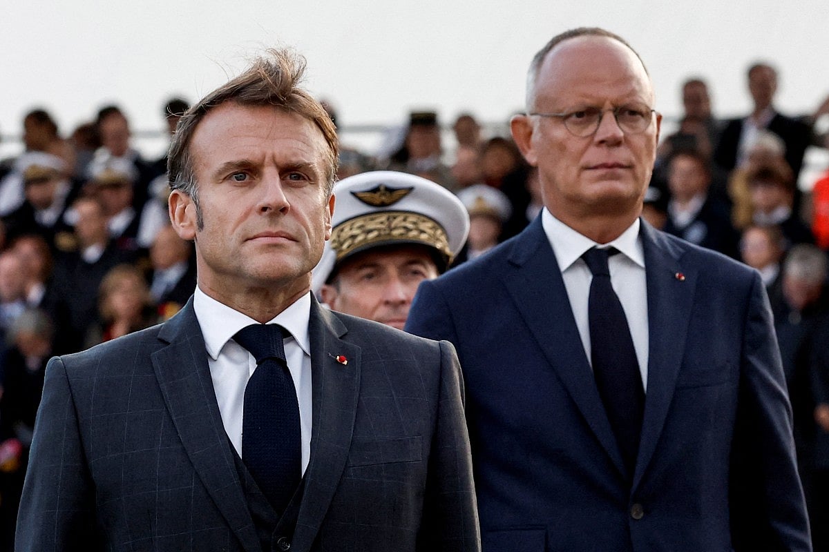 France's President Emmanuel Macron (L) and Mayor of Le Havre Edouard Philippe (R) attend a ceremony commemorating the 80th anniversary of the World War II liberation of the port city of Le Havre, northern France, on September 12, 2024.