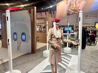 An Emirates cabin crew member showcases the upgraded Smart Tunnel camera feature at the AccessAbilities Expo. 
