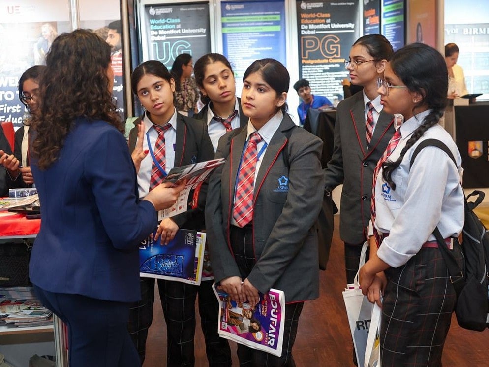 Students attentively listening to a representative at the Gulf News Edufair Dubai 2025.