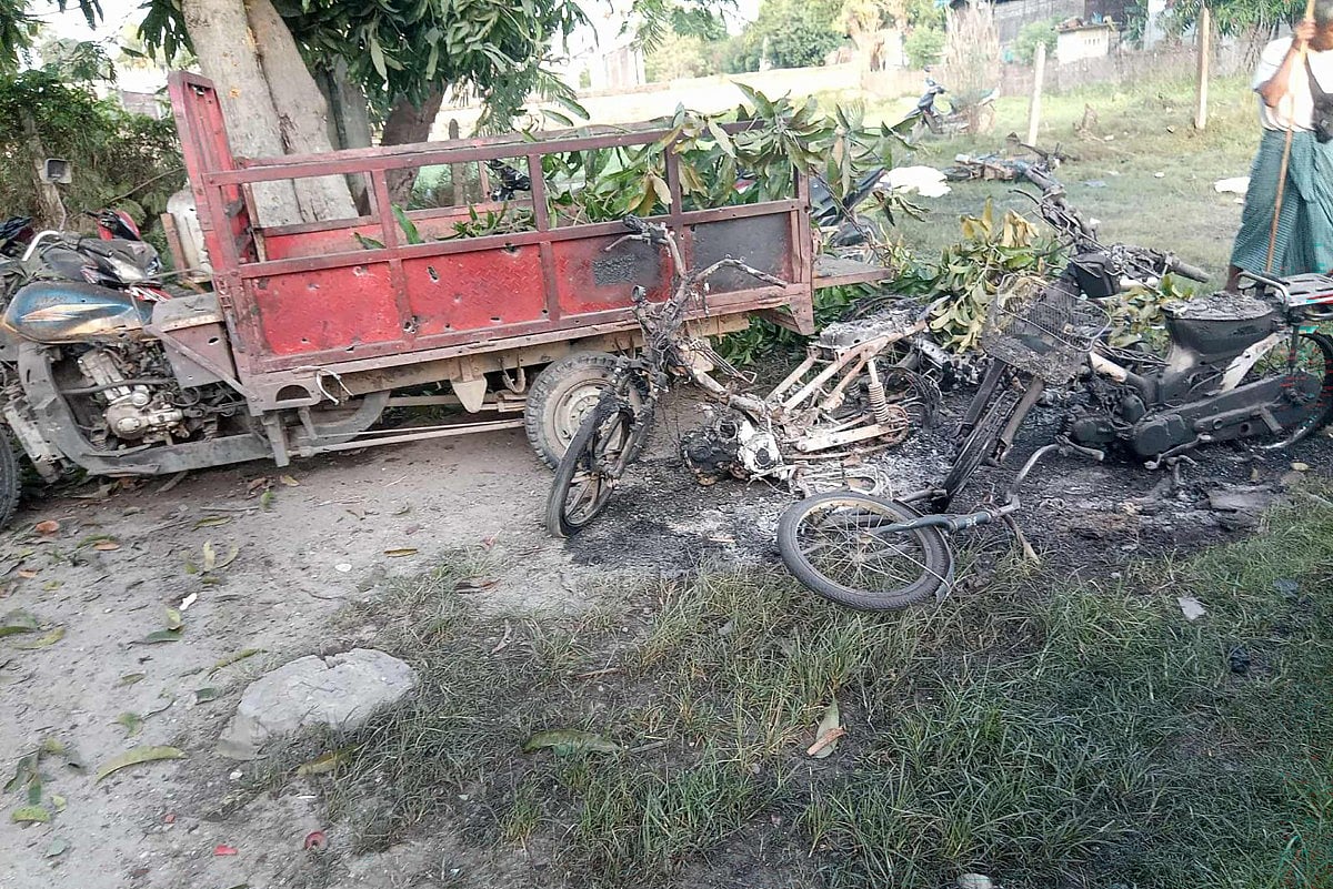 This UGC photo courtesy of Facebook user Yebaw Hlyat Cee taken on October 7, 2025 and received on October 8 shows damage to vehicles at the site of a military strike on a protest in central Myanmar's Chaung U township.
