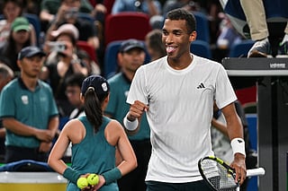 Canada's Felix Auger-Aliassime celebrates after winning against Italy's Lorenzo Musetti during their men's singles match at the Shanghai Masters tennis tournament in Shanghai on October 8, 2025.