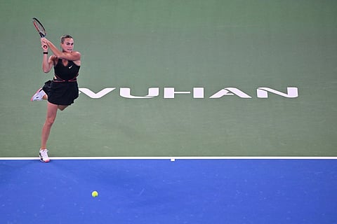 Belarus’ Aryna Sabalenka hits a return to Russia’s Liudmila Samsonova during their women’s singles match at the Wuhan Open tennis tournament in Wuhan, Central China’s Hubei province on October 9, 2025.