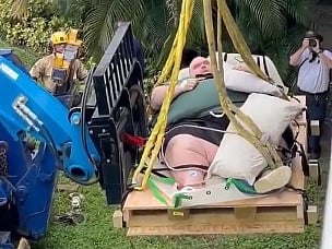  272kg man rescued from home on crane