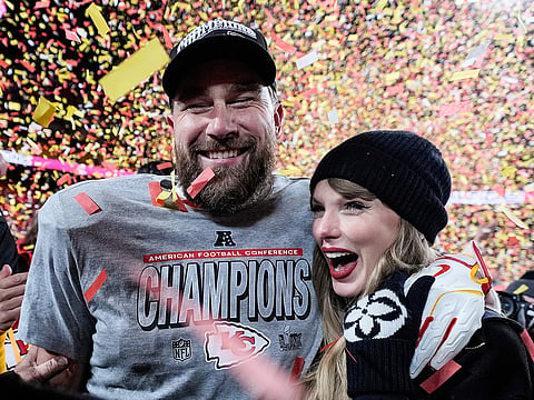  Travis Kelce, left, and Taylor Swift pose after the AFC Championship NFL football game against the Buffalo Bills, Jan. 26, 2025, in Kansas City, Mo. 