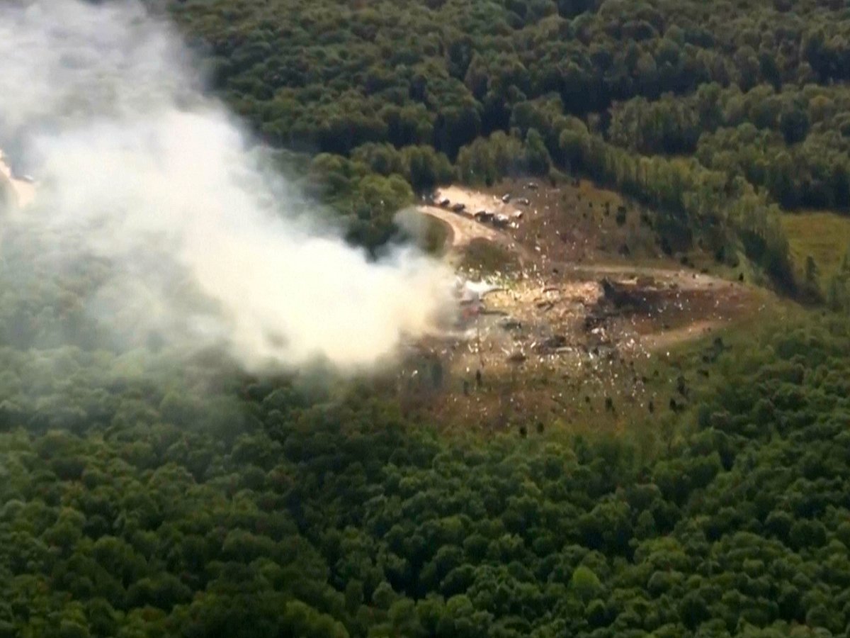 Smoke fills the air as debris covers the ground and vehicles after a powerful blast ripped through a military explosives manufacturing plant in Hickman County, Tennessee, on Friday, October 10, 2025.   
