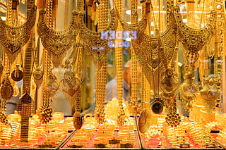 A photo shows gold bangles and necklaces for sale at a gold shop at the Grand Baazar in Istanbul, on October 10, 2025.
