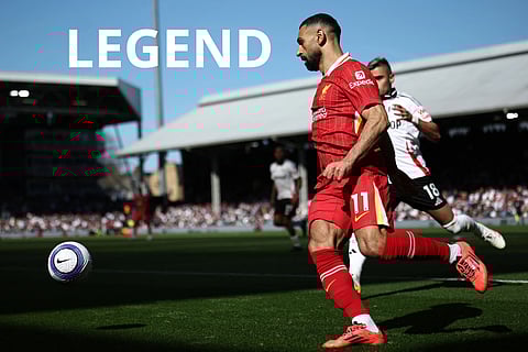 Liverpool's Egyptian striker #11 Mohamed Salah controls the ball during the English Premier League football match between Fulham and Liverpool at Craven Cottage in London on April 6, 2025.