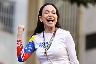 Venezuelan opposition leader Maria Corina Machado gestures supporters during a protest called by the opposition on the eve of the presidential inauguration, in Caracas on January 9, 2025.