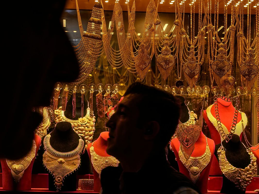People walk past a gold shop at the Grand Baazar in Istanbul, on October 10, 2025.