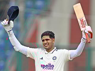 India's captain Shubman Gill celebrates after scoring a century during the second day of the second and last Test against West Indies at the Arun Jaitley Stadium in New Delhi on October 11, 2025. 