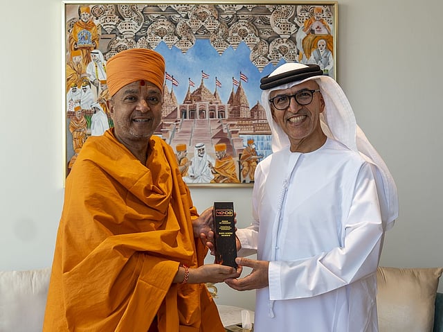 Swami Brahmaviharidas with Dr Mugheer Khamis Al Khaili, Chairman of the Department of Community Development.