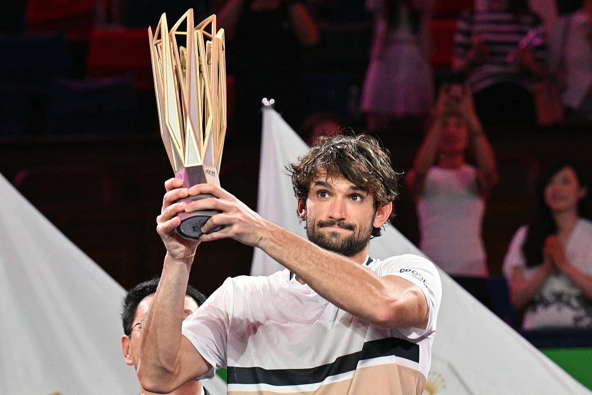 Monaco's Valentin Vacherot holds up the trophy after his victory against France’s Arthur Rinderknech during the men’s singles final at the Shanghai Masters tennis tournament in Shanghai on October 12, 2025.