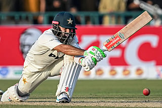 Pakistan's Mohammad Rizwan plays a shot during the first day of the first Test cricket match between Pakistan and South Africa at the Gaddafi Stadium in Lahore on October 12, 2025.