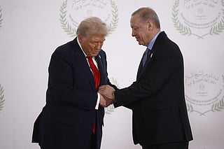 Turkey's President Recep Tayyip Erdogan (R) and US President Donald Trump shake hands during the greetings ceremony at the Gaza Peace Summit in Sharm El-Sheikh, on October 13, 2025. File photo.