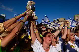 Tears and cheers as first hostages freed in Tel Aviv