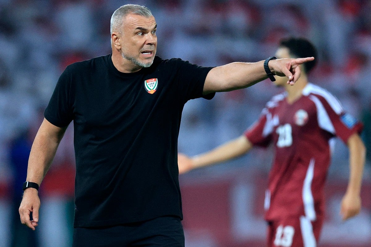 UAE's Romanian coach Cosmin Olaroiu instructs his players during the Fifa World Cup 2026 Asian qualifier football match against Qatar at Jassim Bin Hamad Stadium in Doha on October 14, 2025.