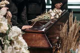 In June 2022, at the funeral of  father-in-law, she noticed an unfamiliar woman among the mourners.