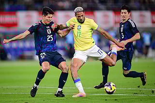 Brazil's midfielder Joelinton (C) shoots the ball during the international football friendly match against Japan at the Tokyo stadium in Chofu, Tokyo prefecture on October 14, 2025.