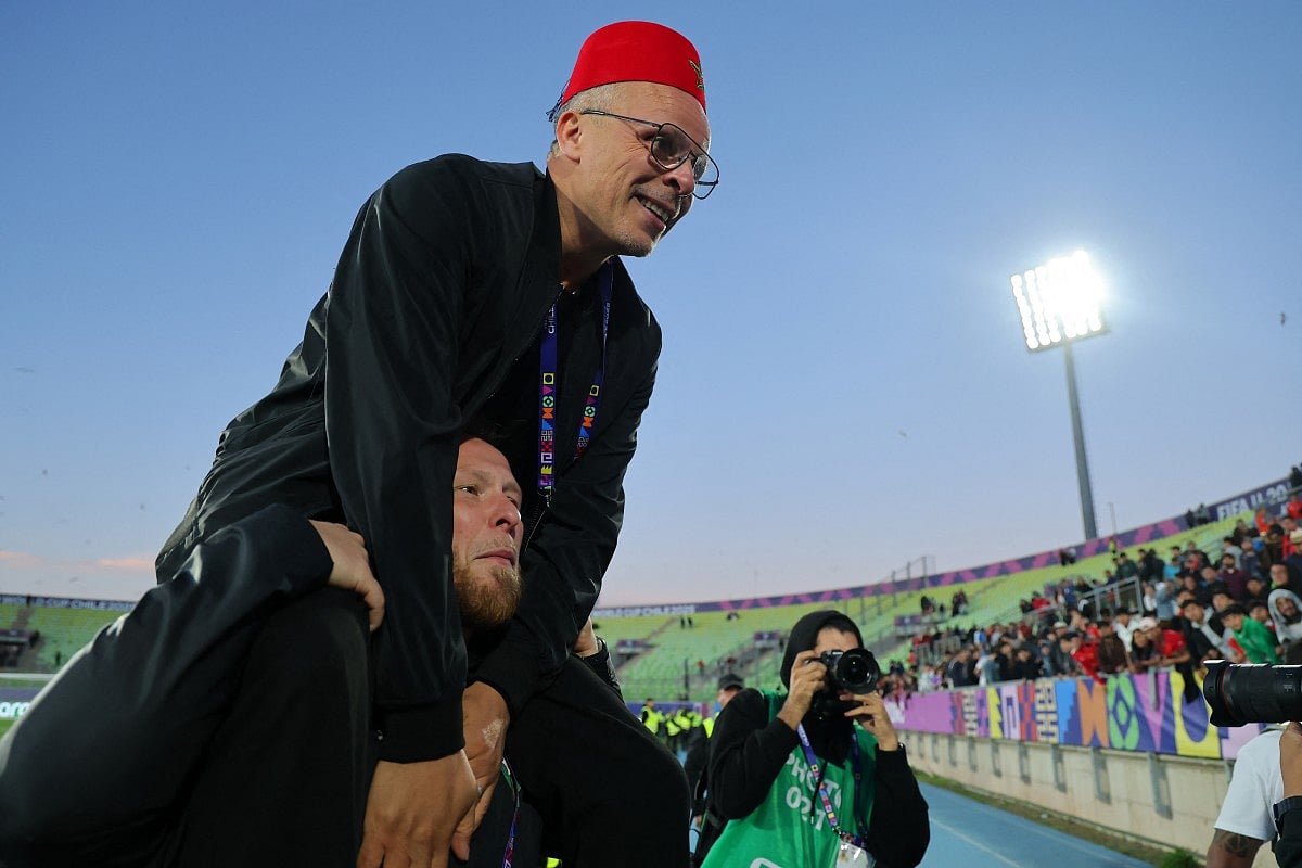 Morocco's head coach Mohamed Ouahbi celebrates his team's victory in the penalty shootout during the 2025 FIFA U-20 World Cup semi-final football match between Morocco and France at the Elias Figueroa Stadium in Valparaiso, Chile on October 15, 2025.