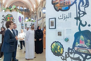 Sheikh Dr Salem bin Abdulrahman Al Qasimi being briefed at the exhibition. 