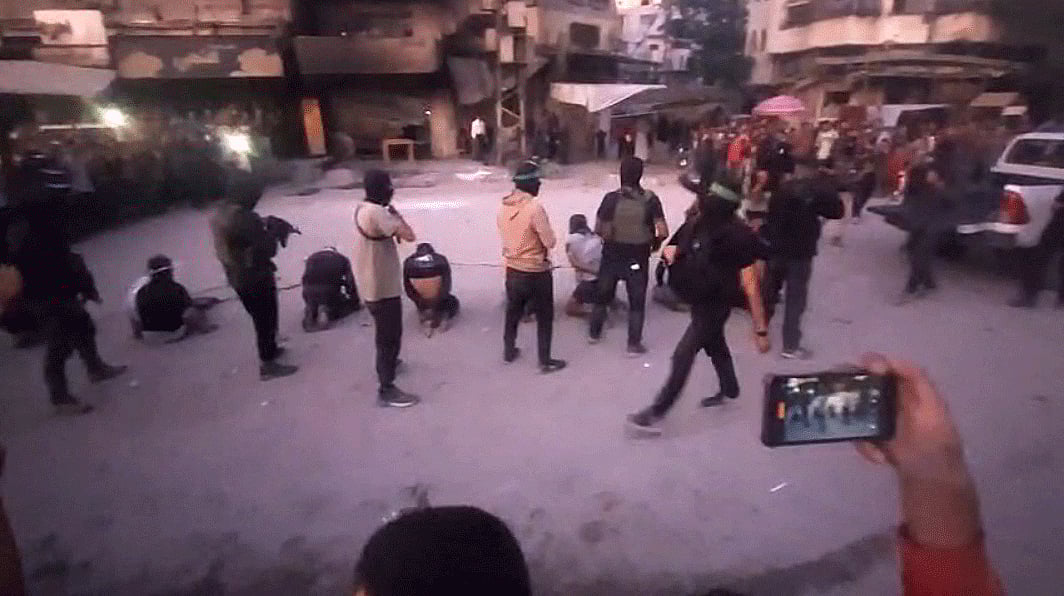 Graphic videos circulating on social media show masked Hamas gunmen executing eight blindfolded men in Gaza City’s Al Sabra neighbourhood before a crowd of onlookers. 