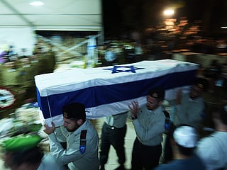 Israeli soldiers carry the coffin of slain hostage Captain Daniel Peretz during his funeral at Mt. Herzl military cemetery in Jerusalem.