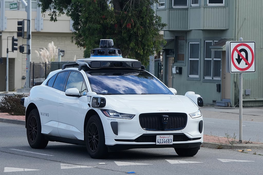 A Waymo vehicle drives past a No U-Turn sign in San Bruno, California, ON Tuesday, Sept. 30, 2025.  