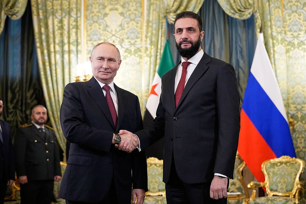 Russian President Vladimir Putin, left, and Syrian interim President Ahmad Al Sharaa during their meeting at the Grand Kremlin Palace in Moscow on October 15, 2025.  