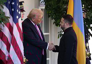 US President Donald Trump (L) greets Ukrainian President Volodymyr Zelensky outside the West Wing of the White House on October 17, 2025, in Washington, DC. 