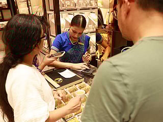 Sales staff attend to a steady stream of buyers taking advantage of festive offers across Dubai’s gold shops.