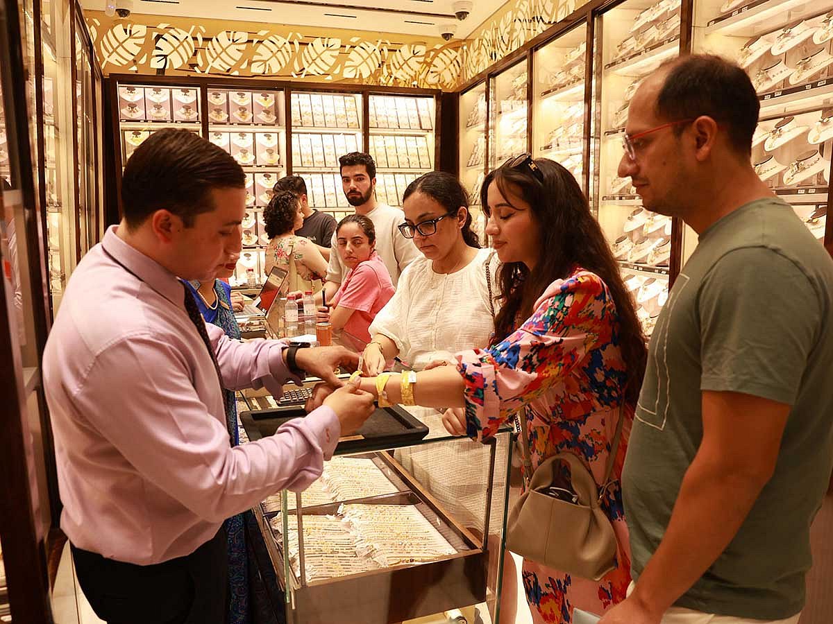 Shoppers crowd a jewellery store in Dubai ahead of Dhanteras, marking the start of festive gold buying.
