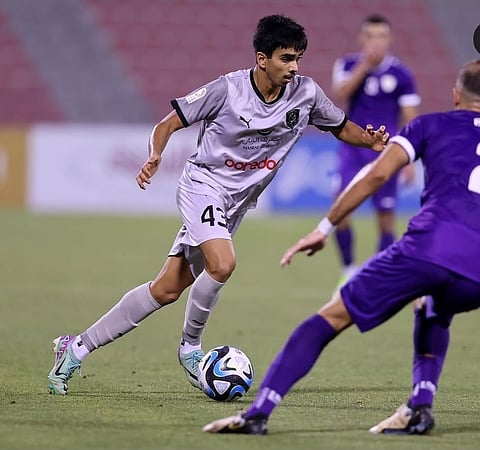 Tahsin celebrating with another Qatari player 