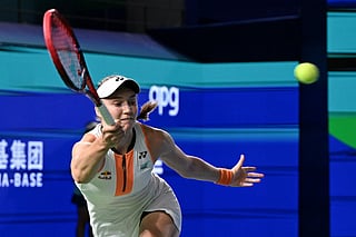 Kazakhstan's Elena Rybakina hits a return to Russia's Ekaterina Alexandrova during the women’s singles final at the WTA Ningbo Open tennis tournament in Ningbo, in China’s eastern Zhejiang province on October 19, 2025.