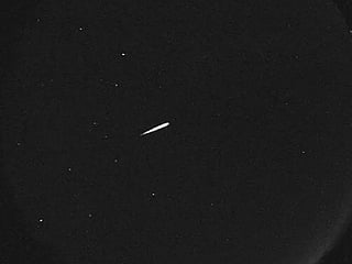 This photo provided by NASA shows a meteor from the Orionid shower on Oct. 13, 2015.