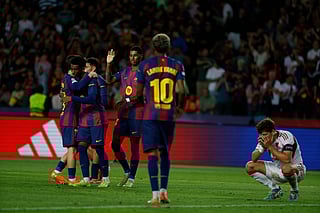 Barcelona's players celebrate the sixth goal of their team during the Champions League opening phase soccer match between Barcelona and Olympiacos in Barcelona, Spain, Tuesday, Oct. 21, 2025. (AP Photo/Joan Monfort)