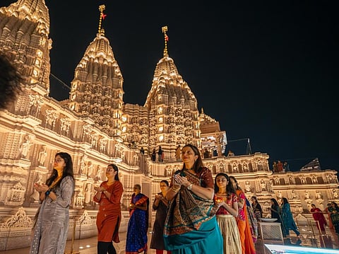 Women take part in the Diwali prayers at the BAPS Hindu Mandir in Abu Dhabi on Monday night. 