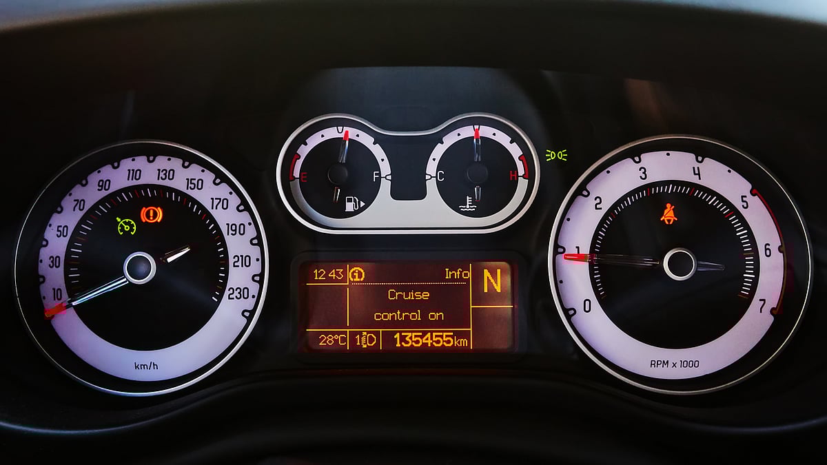 The automobile dashboard. Words on the monitor cruise control on