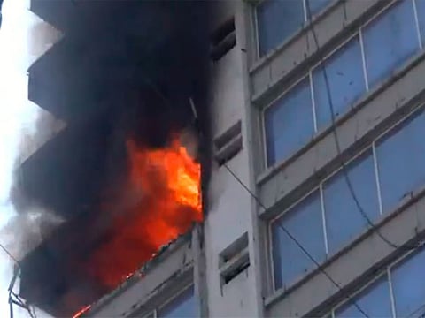 Visuals from the scene showed people stranded on the top floor of the commercial building as firefighters worked to rescue them.