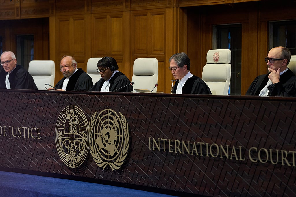 Presiding Judge Yuji Iwasawa, second right, starts reading the advisory opinion of the International Court of Justice on what Israel must do to ensure humanitarian aid reaches Palestinians in Gaza and the occupied West Bank, in The Hague, Netherlands, Wednesday, Oct. 22, 2025. (AP Photo/Peter Dejong)