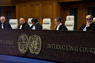 Presiding Judge Yuji Iwasawa, second right, starts reading the advisory opinion of the International Court of Justice on what Israel must do to ensure humanitarian aid reaches Palestinians in Gaza and the occupied West Bank, in The Hague, Netherlands, Wednesday, Oct. 22, 2025. 