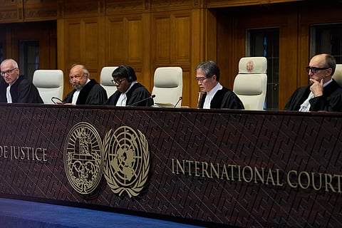 Presiding Judge Yuji Iwasawa, second right, starts reading the advisory opinion of the International Court of Justice on what Israel must do to ensure humanitarian aid reaches Palestinians in Gaza and the occupied West Bank, in The Hague, Netherlands, Wednesday, Oct. 22, 2025. 