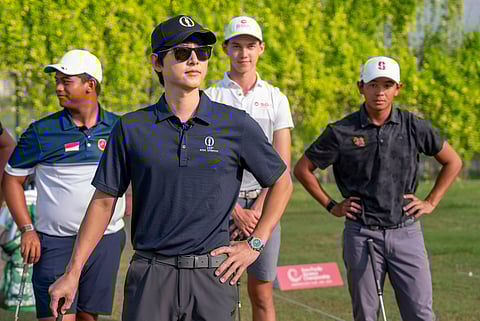 Song Joong-ki playing golf in Emirates Golf Club's Majlis course