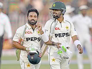 Pakistan's Mohammad Rizwan (L) and Babar Azam