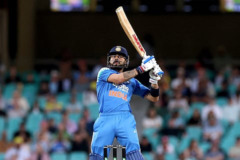 India’s Virat Kohli hits a boundary during the third one-day international cricket match between Australia and India at the SCG in Sydney on October 25, 2025.
