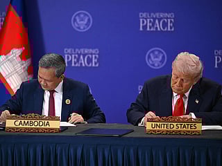 US President Donald Trump (R) and Cambodia's Prime Minister Hun Manet sign documents during a ceremonial signing of a ceasefire agreement between Cambodia and Thailand on the sidelines of the 47th Association of Southeast Asian Nations (ASEAN) Summit in Kuala Lumpur on October 26, 2025. 