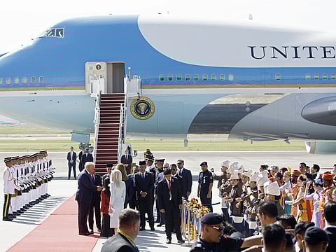 US President Donald Trump, left, shakes hands with guests following his arrival at Kuala Lumpur International Airport in Sepang, Selangor, Malaysia, on Sunday, October 26, 2025. 