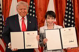 Japan's Prime Minister Sanae Takaichi (R) and US President Donald Trump attend a signing ceremony after a Japan-US Summit at the Akasaka State Guest House in Tokyo on October 28, 2025.