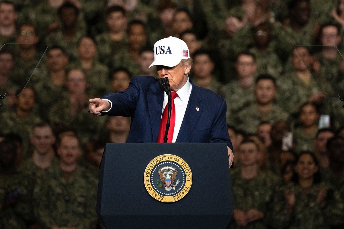 US President Donald Trump gestures as he delivers a speech to US Navy personnel on board the US Navy's USS George Washington aircraft carrier at the US naval base in Yokosuka on October 28, 2025.