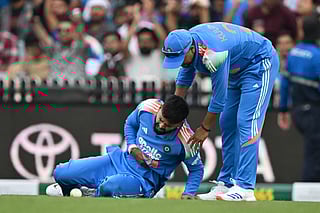 A file photo taken on October 25, 2025 shows India’s Shreyas Iyer (L) reacting in pain as he leaves the field during the third one-day international (ODI) men's cricket match between Australia and India at the Sydney Cricket Ground in Sydney.
